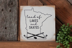 Land of Lakes and Skates Sign